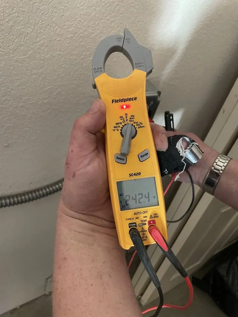 Voltage testing with clamp meter during Whole House Surge Protector in Country Squire Lakes